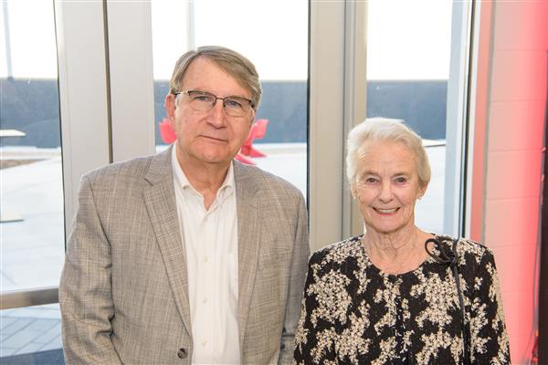 Dr. Mike Kulovitz and Pat Blinn smile to camera.